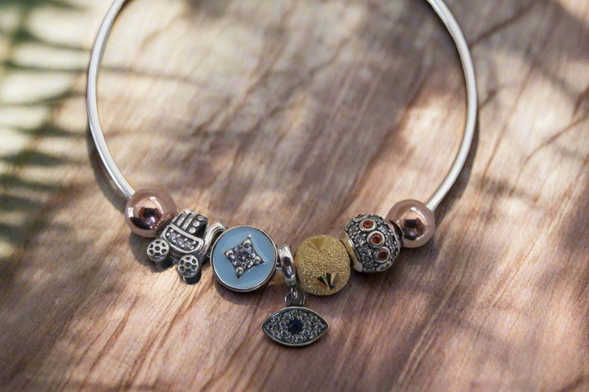 Evil eye and stroller charm bracelet