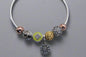 Yellow flower charm bracelet