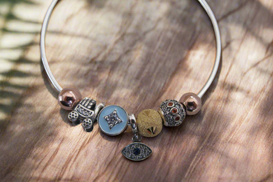 Evil eye and stroller charm bracelet