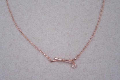Bow with charm chain and pendant
